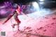 A woman in a pink outfit is standing on a red planet.